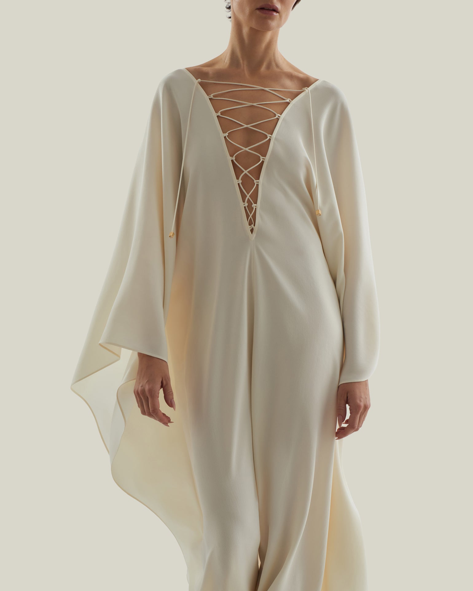 Sahara Kaftan in Ivory - Crepe cady laced-up plunge neckline kaftan with frontal slit