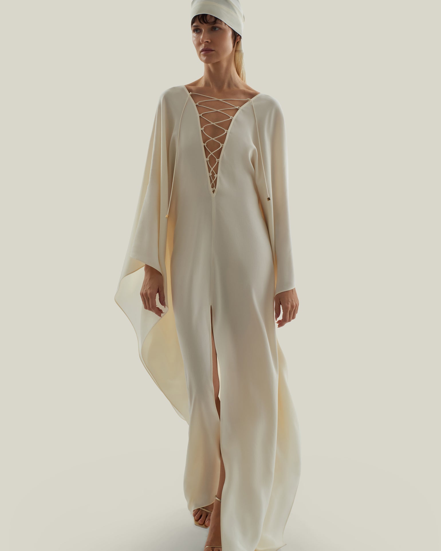 Sahara Kaftan in Ivory - Crepe cady laced-up plunge neckline kaftan with frontal slit