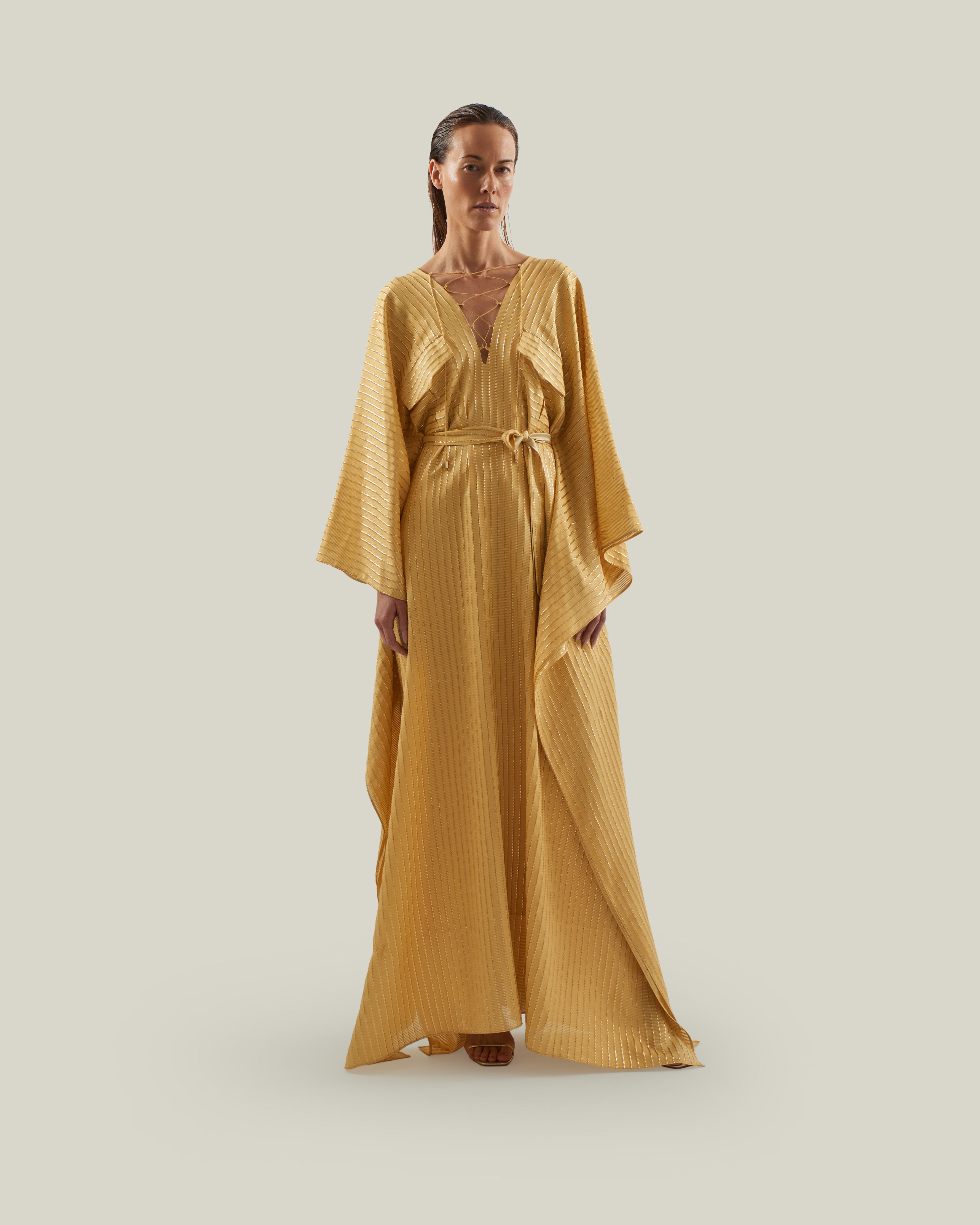 Mojave Kaftan in Antique Gold - Three-dimensional lurex pin stripe laced-up neckline belted kaftan with pockets