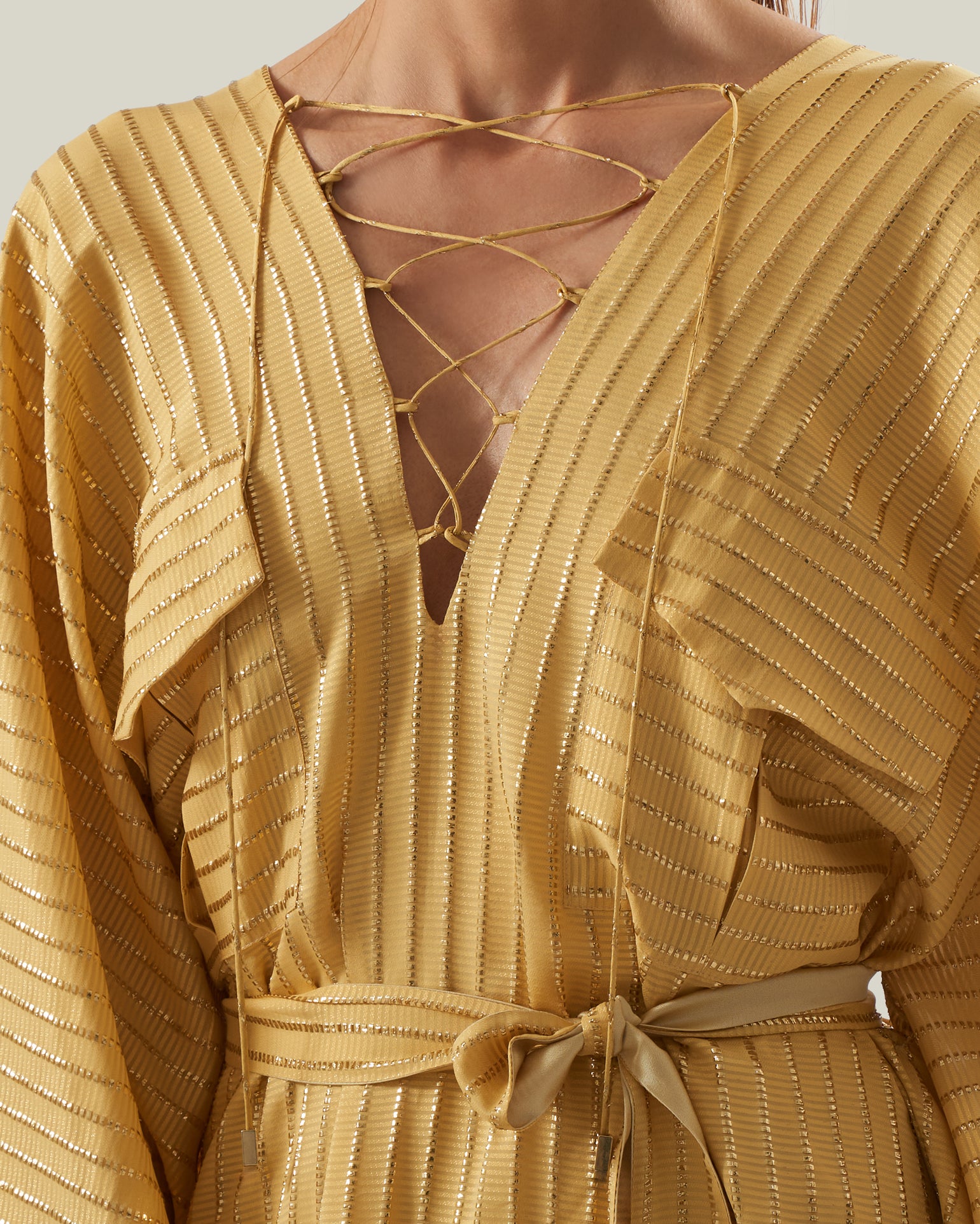 Mojave Kaftan in Antique Gold - Three-dimensional lurex pin stripe laced-up neckline belted kaftan with pockets
