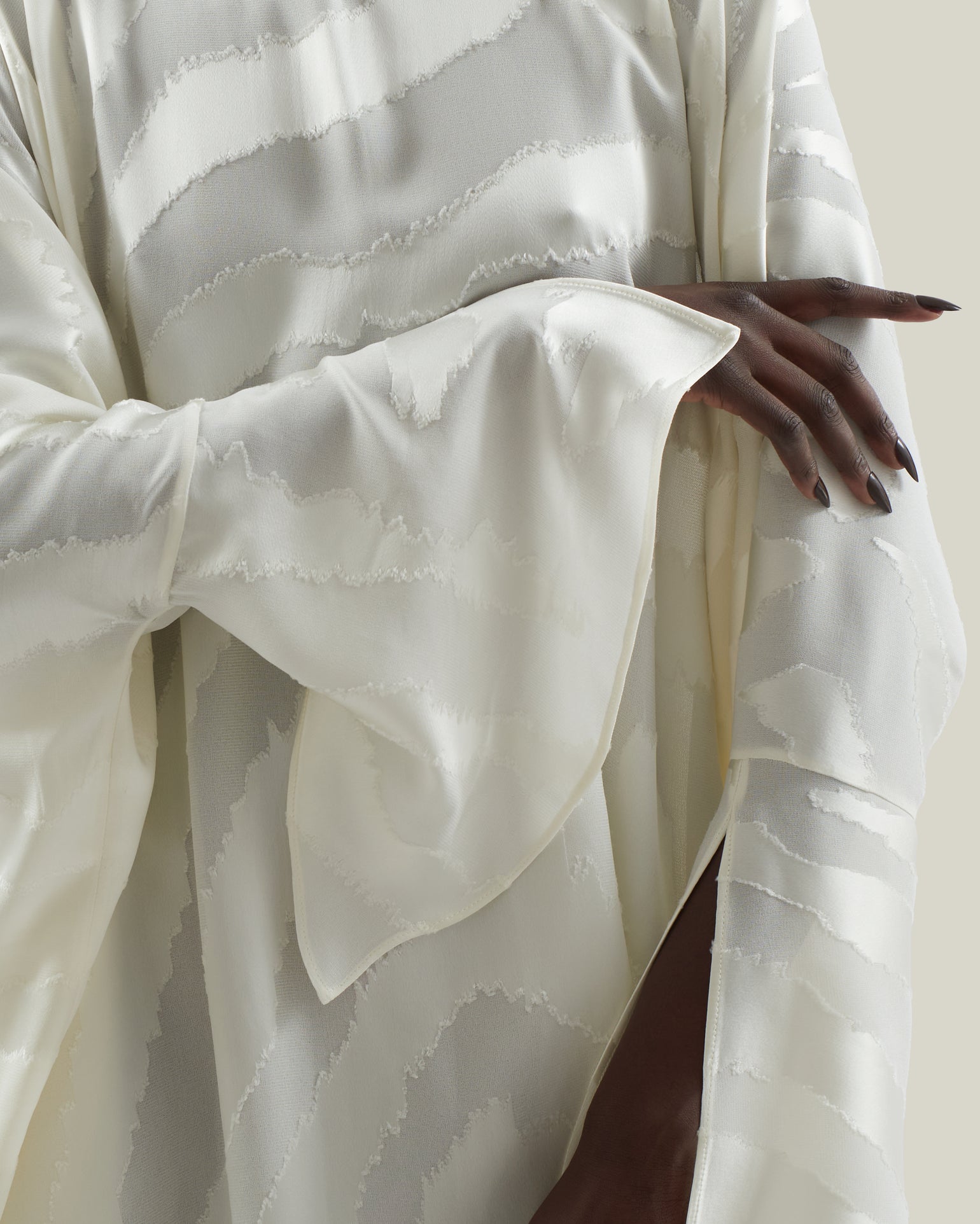 Thar Kaftan in Ivory - Zebra motif fil coupè high-low hem short kaftan with cuffs