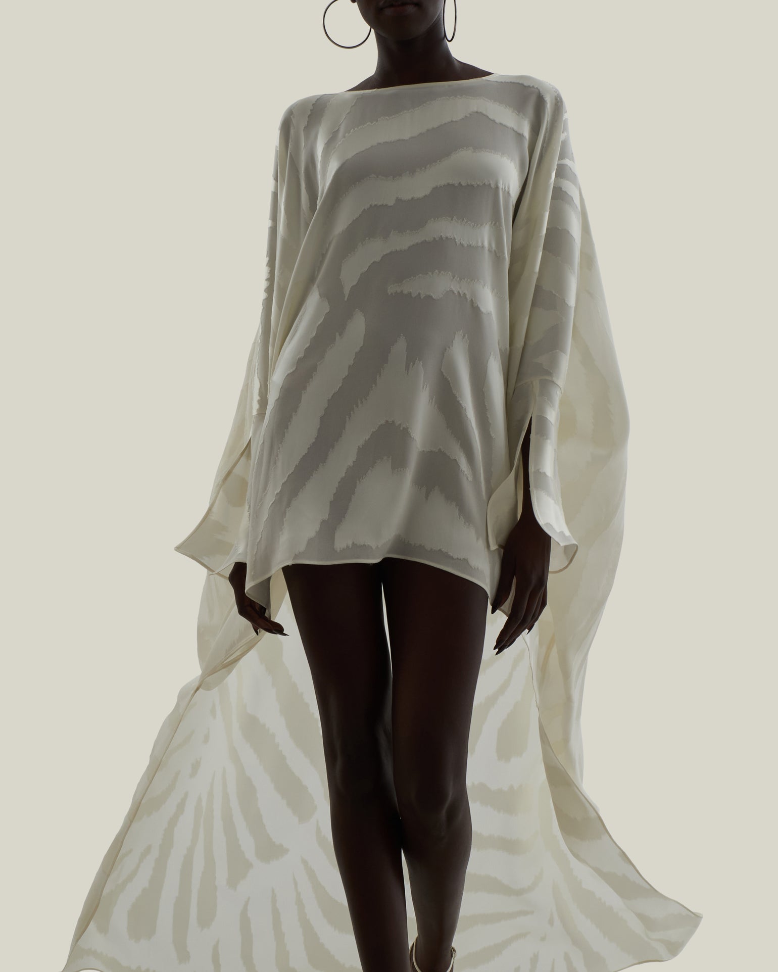 Thar Kaftan in Ivory - Zebra motif fil coupè high-low hem short kaftan with cuffs