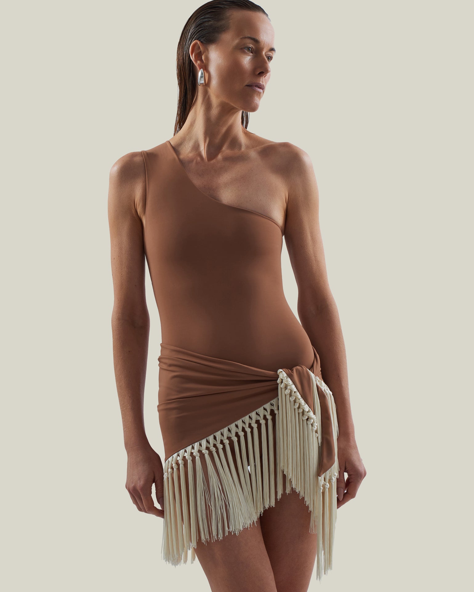 Yacare Swimsuit in Camel-Ivory - One shoulder swimsuit and dettached hand-tied fringed trimmed mini pareo set
