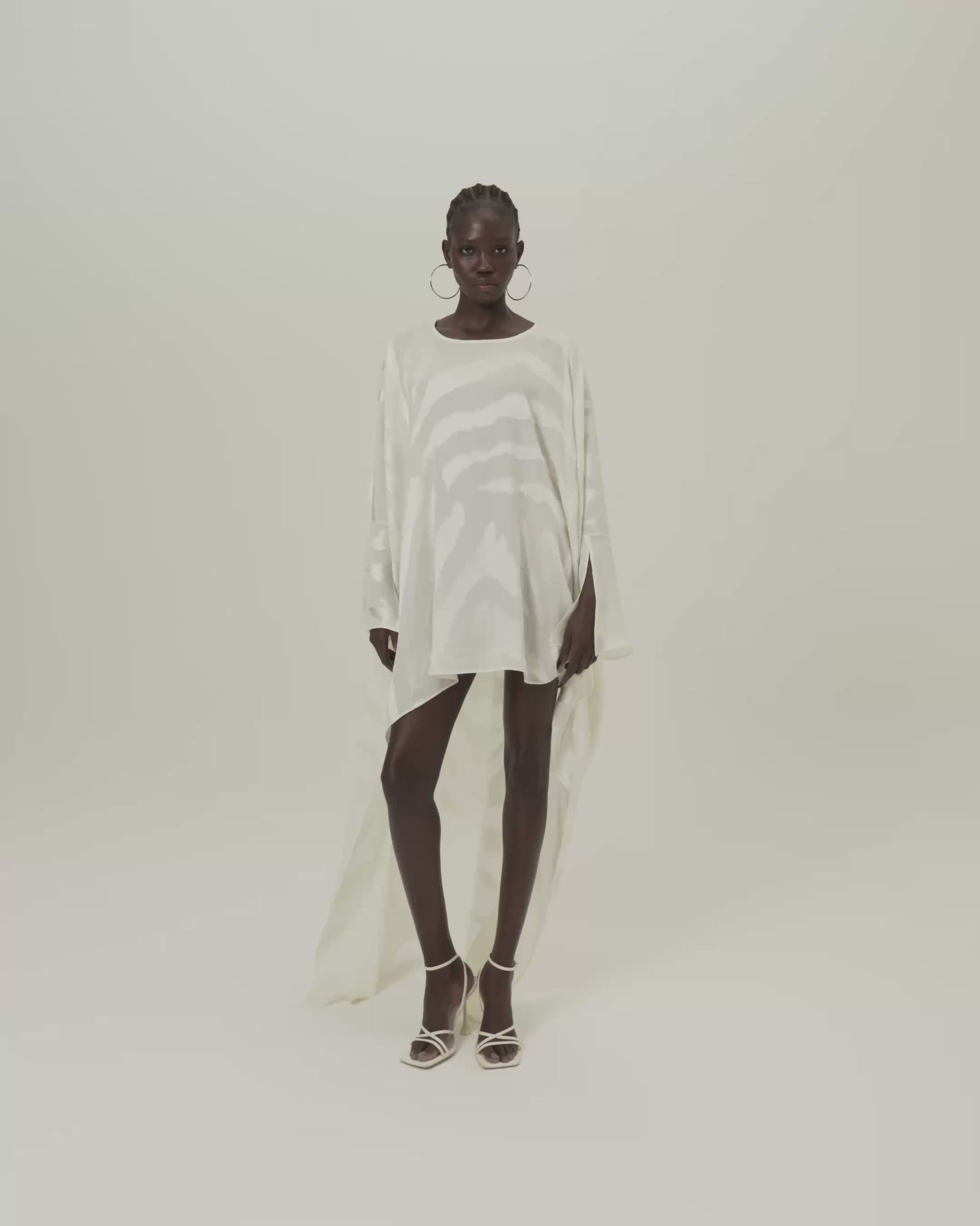 Thar Kaftan in Ivory - Zebra motif fil coupè high-low hem short kaftan with cuffs